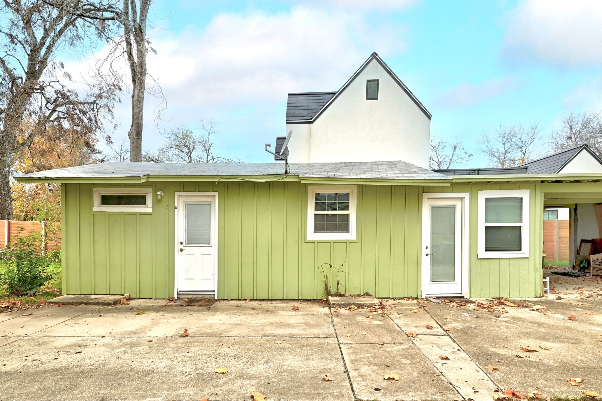 1706 Riverview Street, Unit A Austin, TX 78702 - Photo 20 of 23 a view of a house with a wooden roof and windows