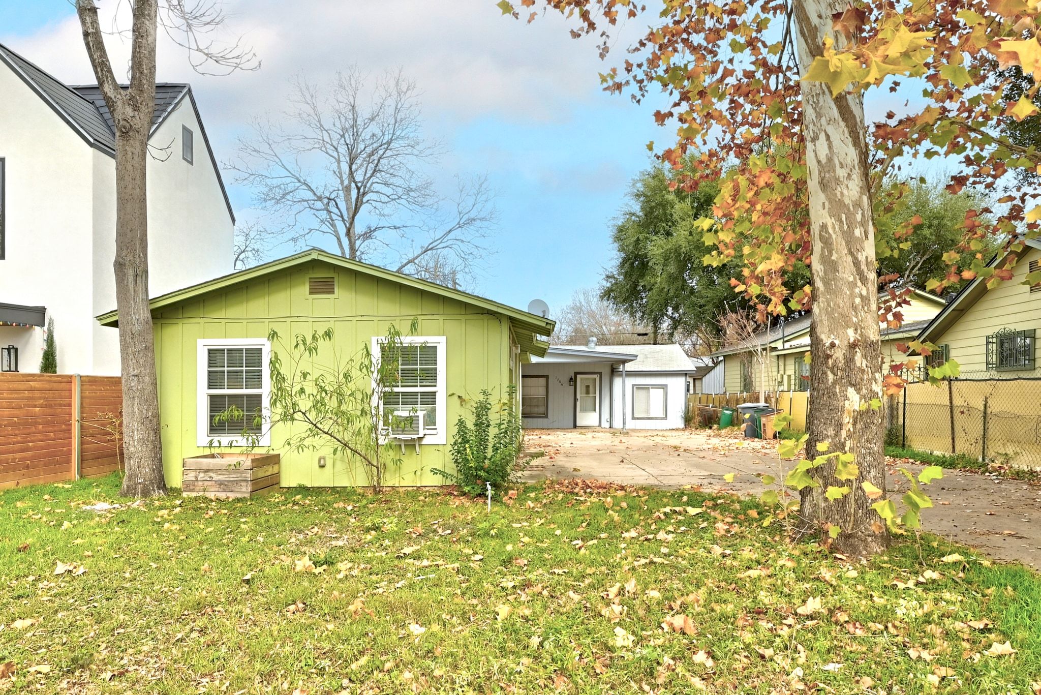 1706 Riverview Street, Unit A Austin, TX 78702 - Photo 21 of 23 a front view of a house with a garden