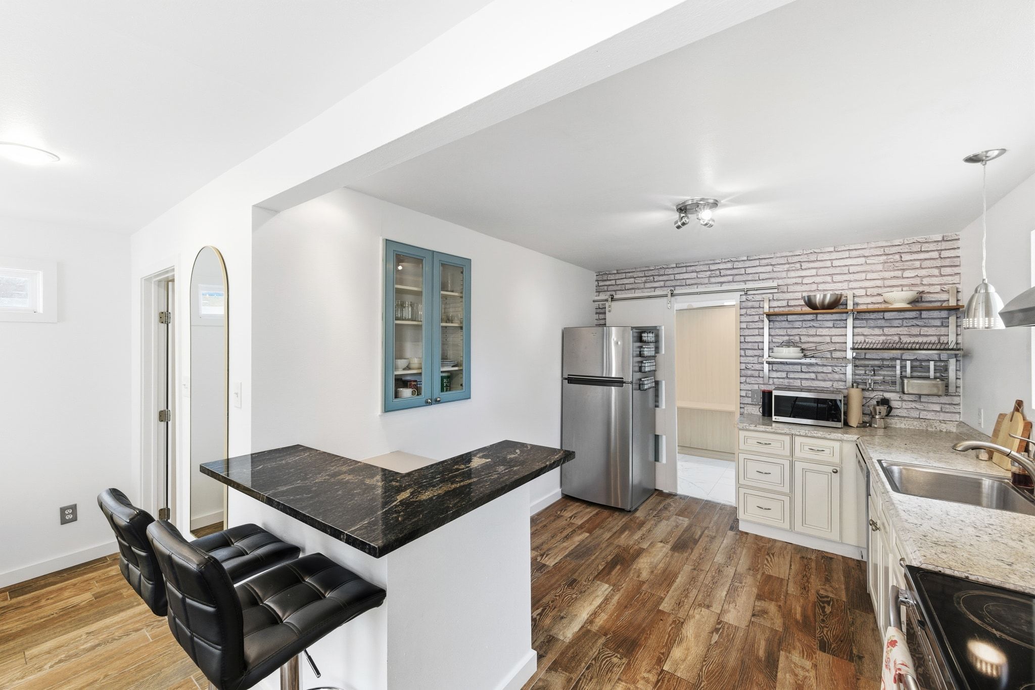 1706 Riverview Street, Unit A Austin, TX 78702 - Photo 6 of 23 a living room with stainless steel appliances furniture and a kitchen view