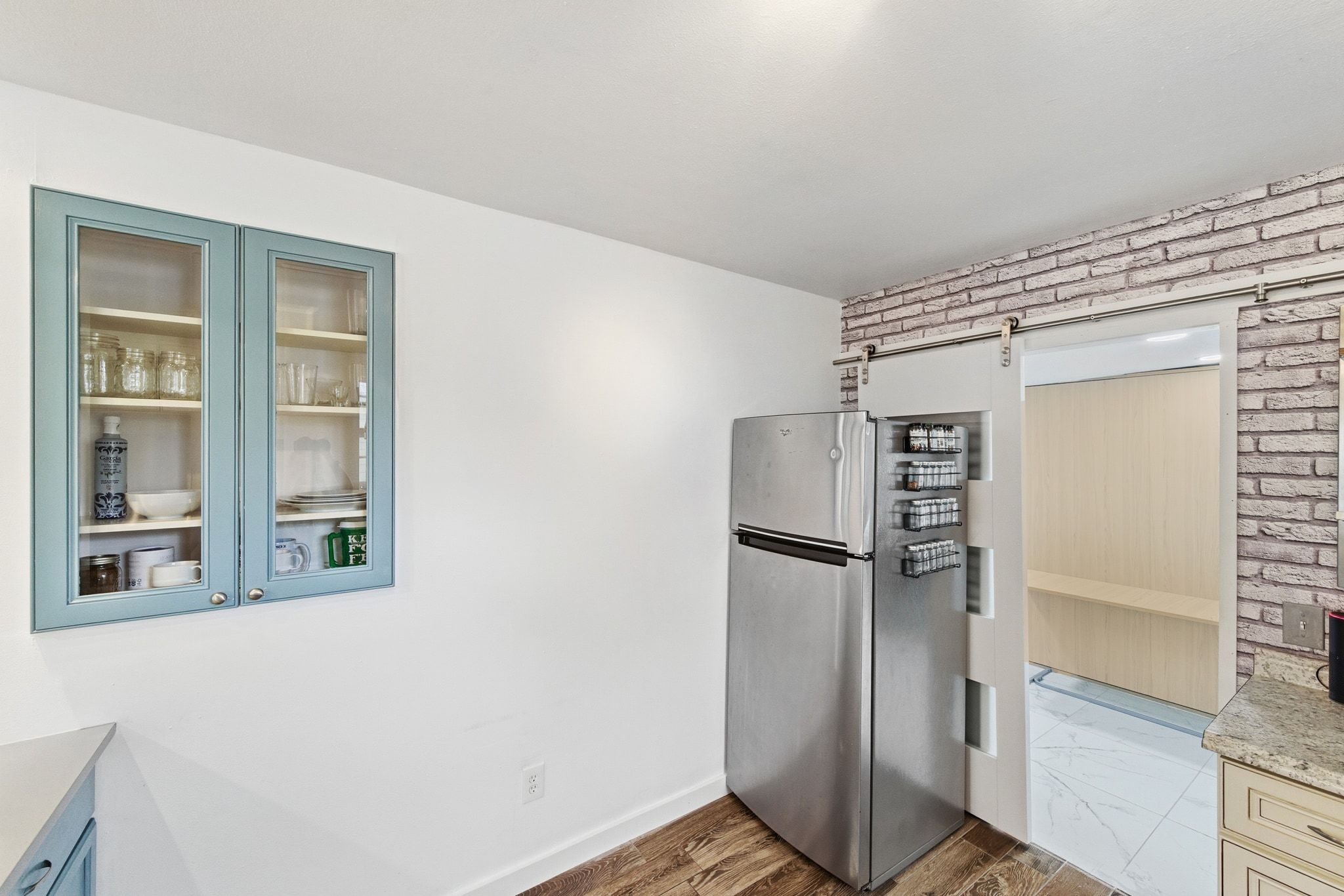 1706 Riverview Street, Unit A Austin, TX 78702 - Photo 8 of 23 a kitchen with a refrigerator and dryer