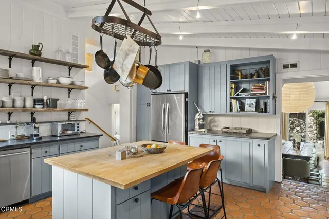 a kitchen with a table and chairs in it