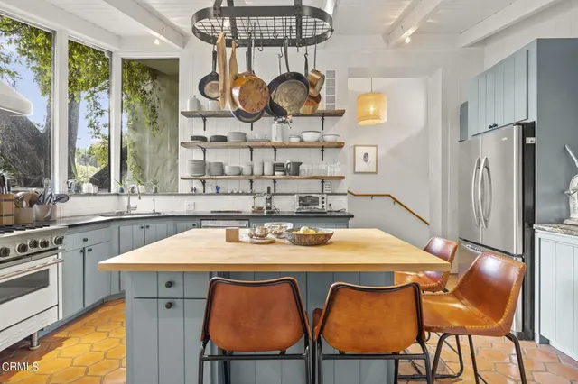 a kitchen with a table and chairs in it