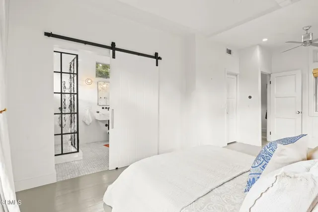 a bedroom with a bed and a closet