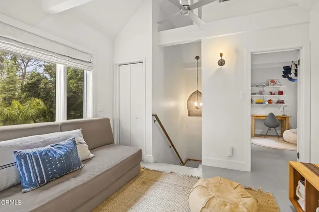 a living room with furniture and a rug