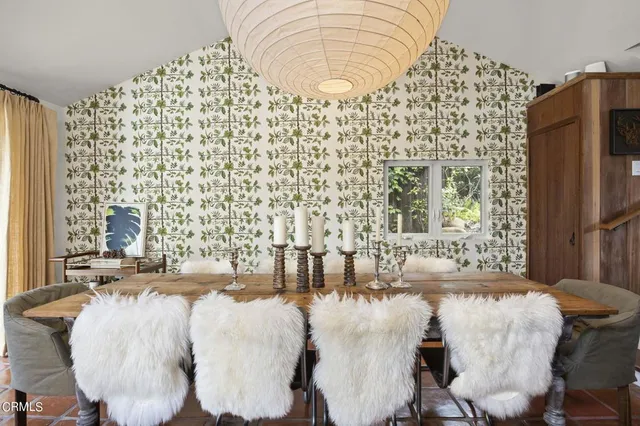 a living room with fireplace furniture and a flat screen tv