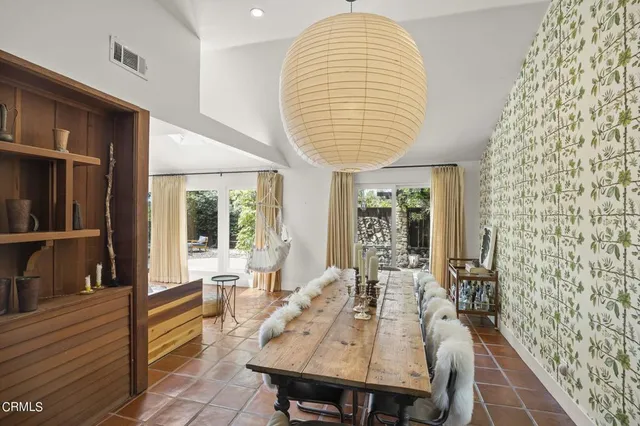 a very nice looking dining room with a table and chairs