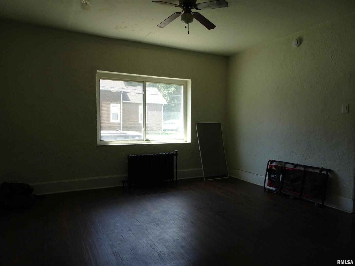 1930 9th Street Rock Island, IL 61201 - Photo 4 of 17 an empty room with a window