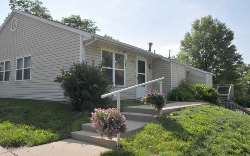 200 High Street Liberty, MO 64068 - Photo 4 of 8 a front view of a house with garden