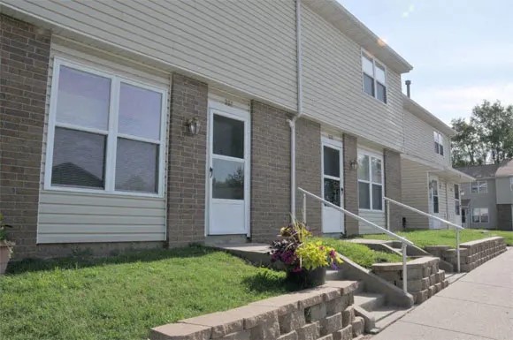 200 High Street Liberty, MO 64068 - Photo 5 of 8 a front view of a house with garden