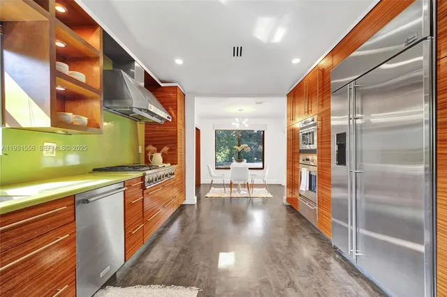 a bathroom with a double vanity sink and a large mirror