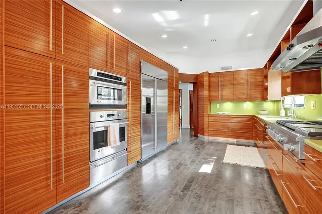 a bathroom with a double vanity sink a mirror and a bathtub