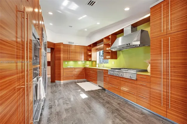 a bedroom with a bed a window and a potted plant