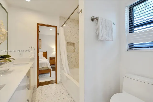 a dining room with furniture and garden view