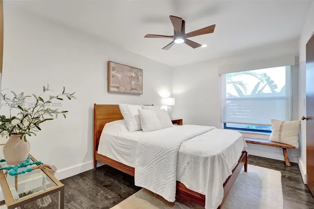 a view of a porch with furniture and wooden floor