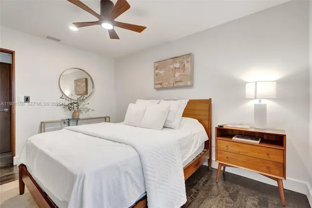 a dining room with furniture window and wooden floor
