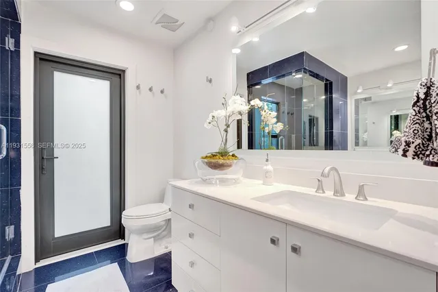 an aerial view of multiple houses with yard