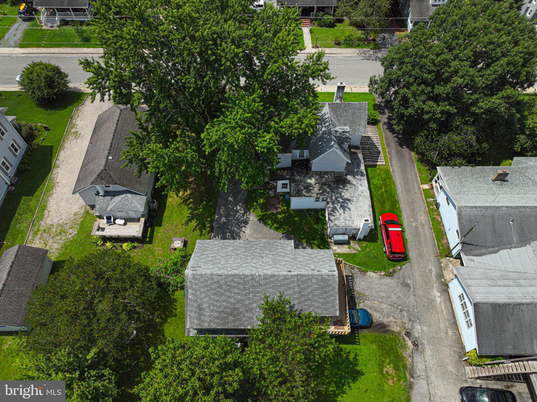 17 Burley Street Berlin, MD 21811 - Photo 103 of 150 an aerial view of a house with a yard and large trees