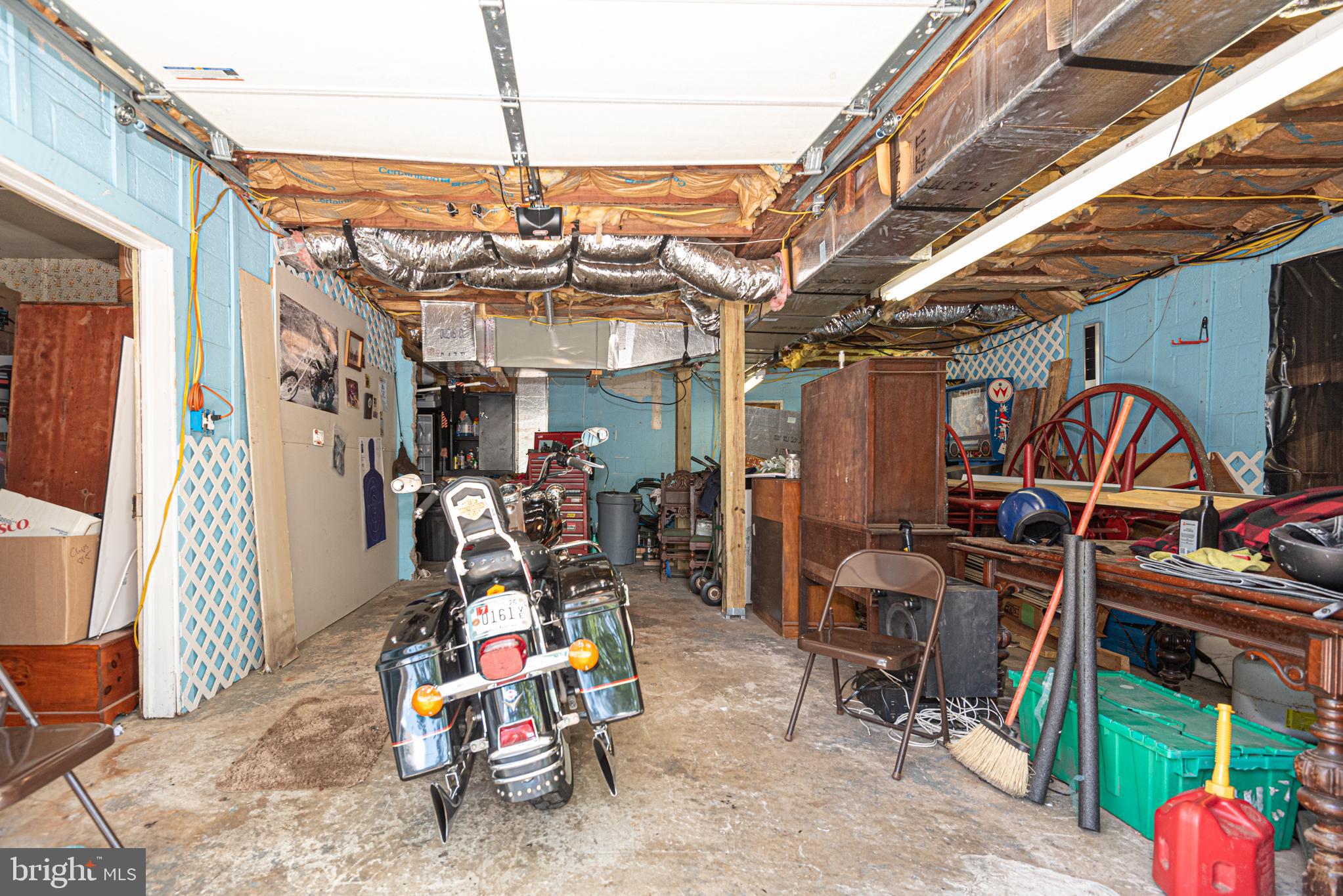17 Burley Street Berlin, MD 21811 - Photo 106 of 150 a view of a storage room with a lot of stuff and couches