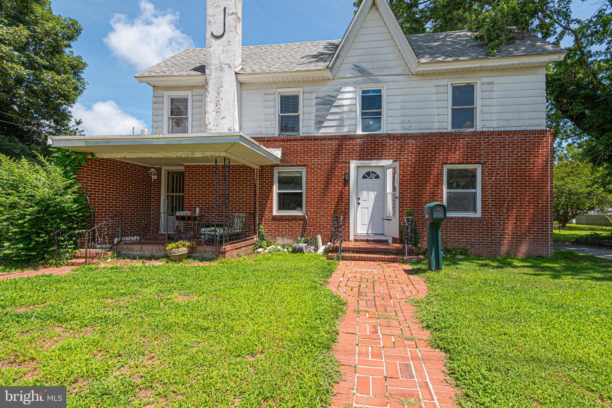 17 Burley Street Berlin, MD 21811 - Photo 110 of 150 a front view of a house with a garden