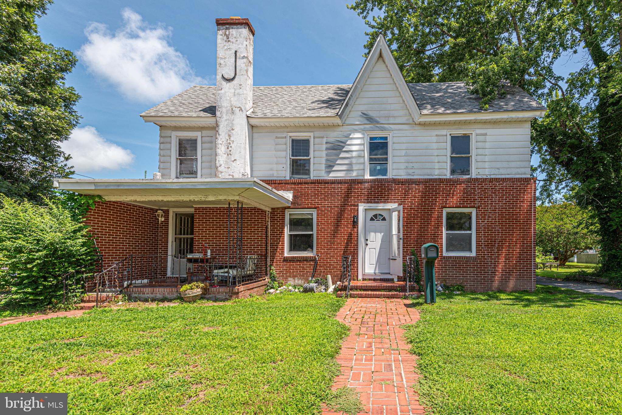 17 Burley Street Berlin, MD 21811 - Photo 111 of 150 a front view of house with a garden and patio