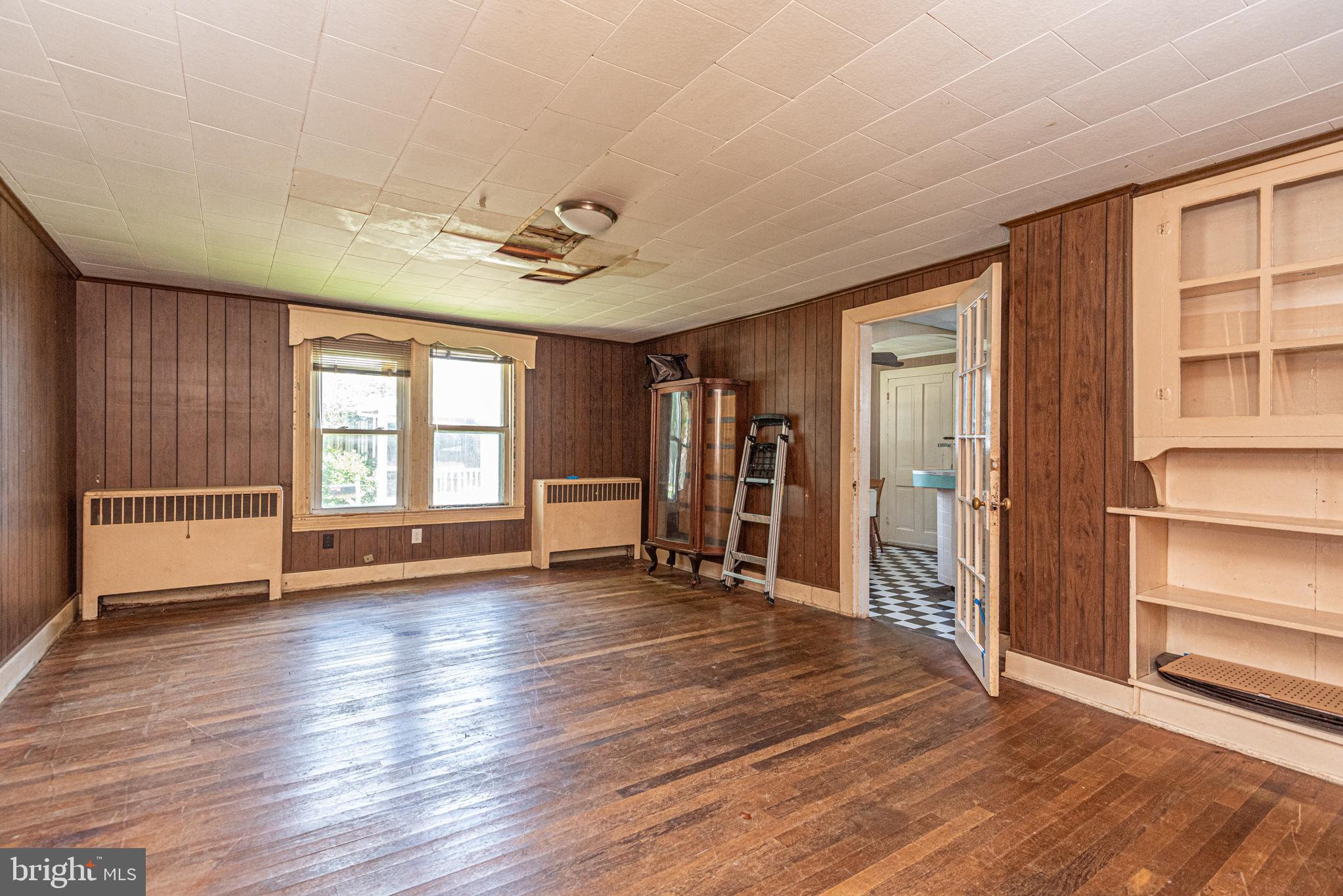 17 Burley Street Berlin, MD 21811 - Photo 122 of 150 an empty room with wooden floor and windows