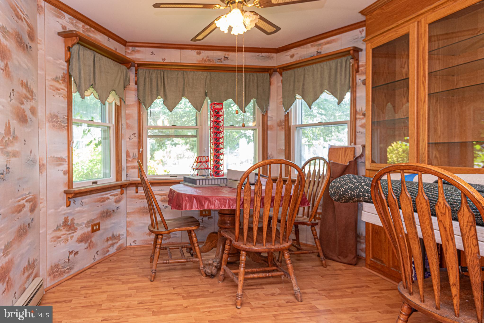 17 Burley Street Berlin, MD 21811 - Photo 13 of 150 a view of a dining room with furniture large windows and wooden floor