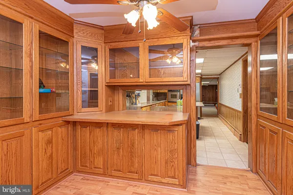 a kitchen with stainless steel appliances white cabinets and a refrigerator