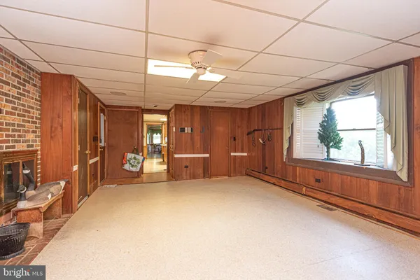 an aerial view of a house with a yard basket ball court and outdoor seating