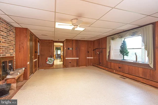 an aerial view of a house with a yard basket ball court and outdoor seating