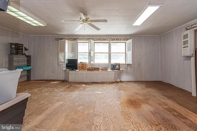 an aerial view of a house with outdoor space swimming pool outdoor seating and yard