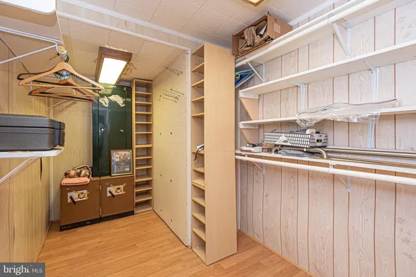 a view of a storage room with a lot of stuff and couches