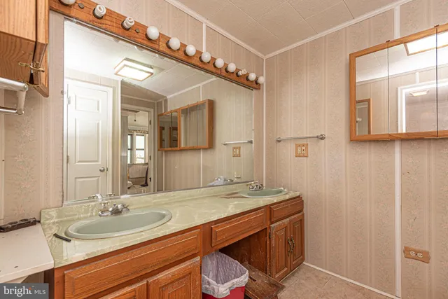 a view of a room with wooden floor and cabinet