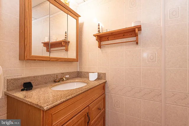 a kitchen with a stove a sink and a refrigerator