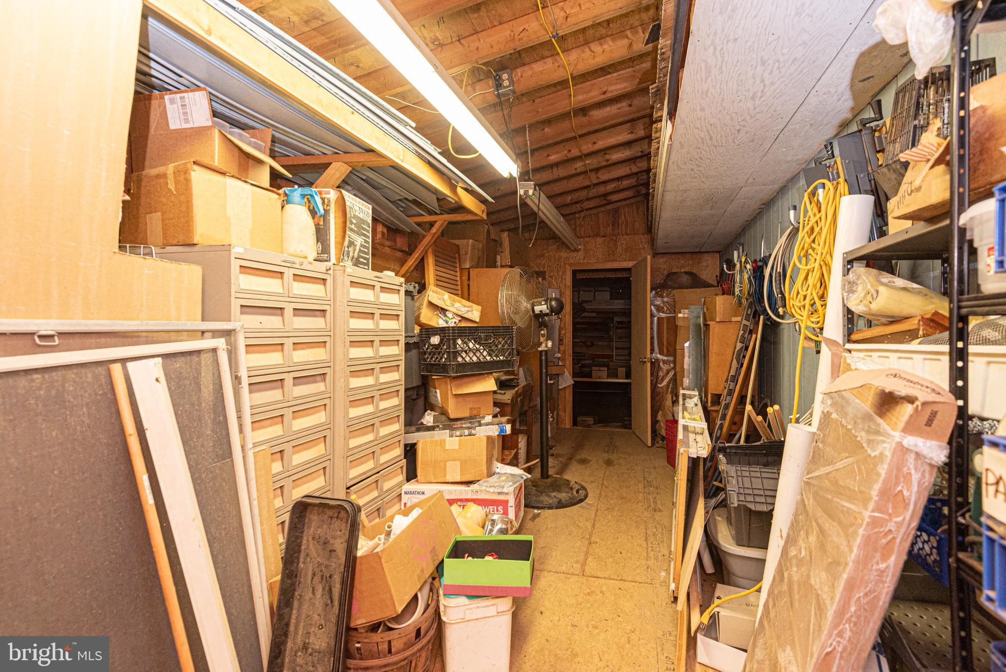 17 Burley Street Berlin, MD 21811 - Photo 61 of 150 a view of walk in closet with clothes and shoes