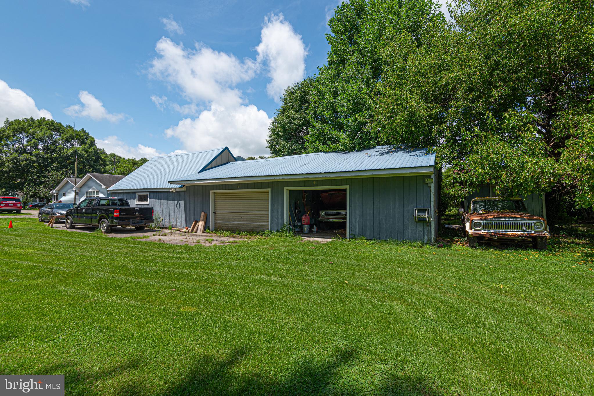 17 Burley Street Berlin, MD 21811 - Photo 74 of 150 a front view of a house with a garden and trees
