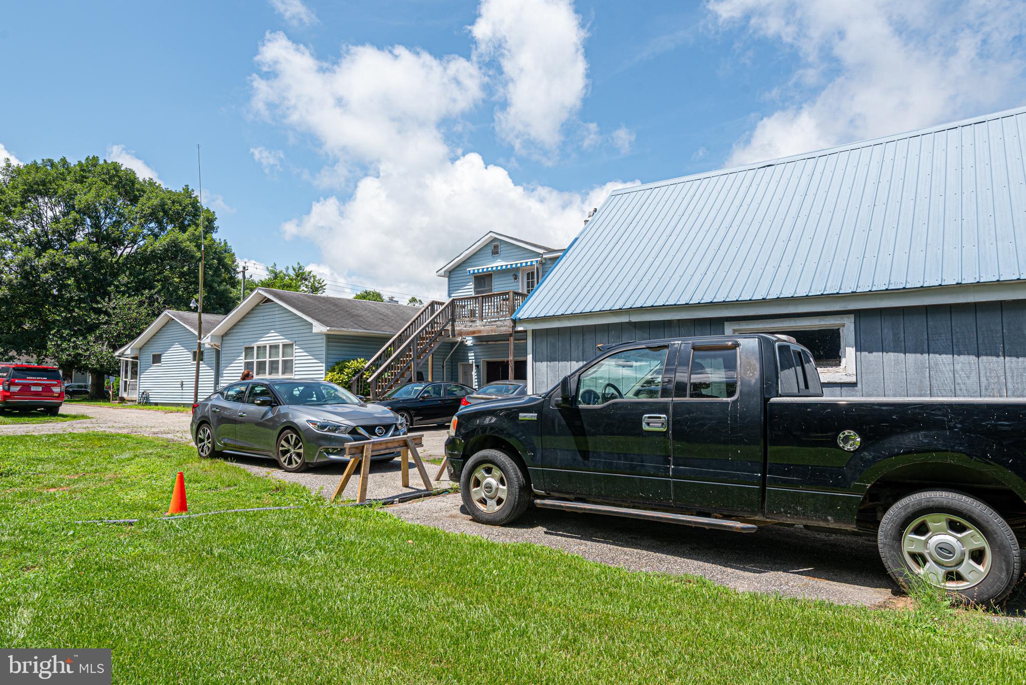 17 Burley Street Berlin, MD 21811 - Photo 75 of 150 a front view of a house with a garden