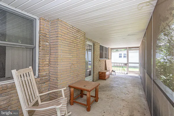 a view of a brick house with a large window