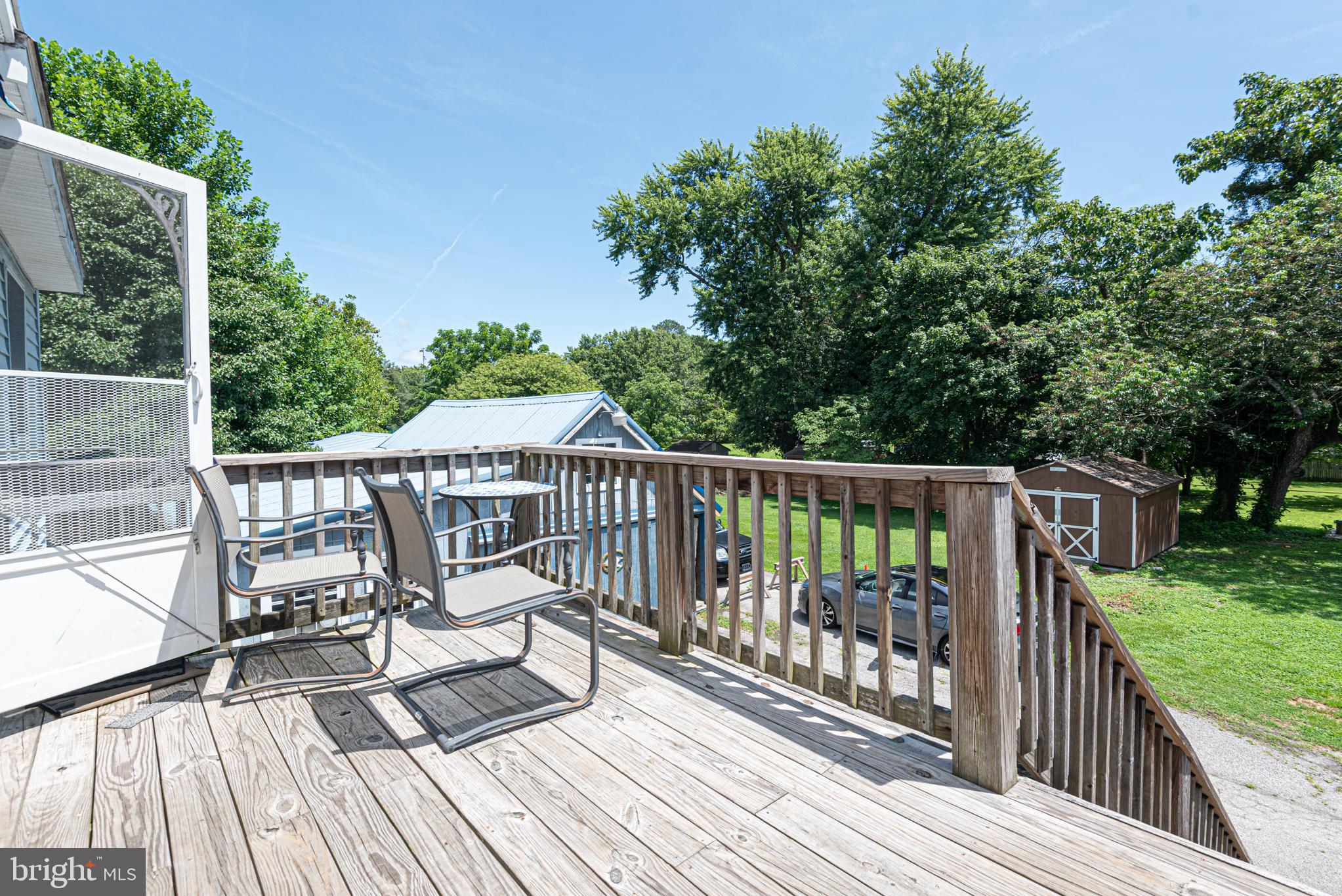 17 Burley Street Berlin, MD 21811 - Photo 86 of 150 a view of a wooden deck with a bench