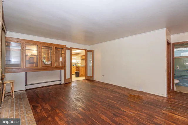 a kitchen with stainless steel appliances granite countertop a sink counter space cabinets and a large window