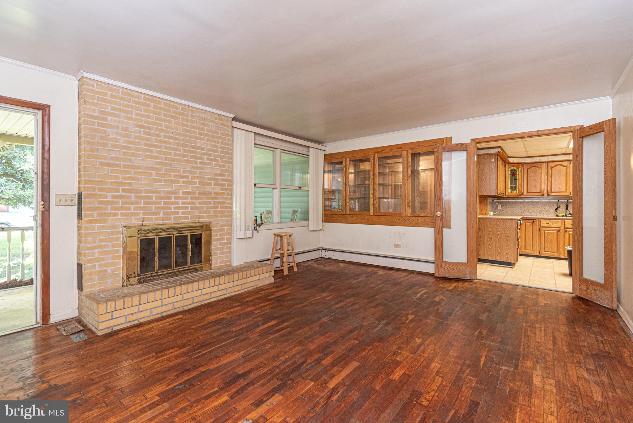 17 Burley Street Berlin, MD 21811 - Photo 10 of 150 wooden floor fireplace and windows in an empty room