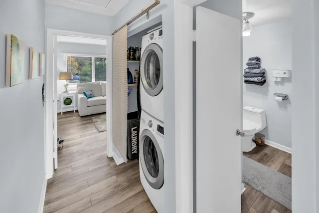 a view of a hallway with washer and dryer
