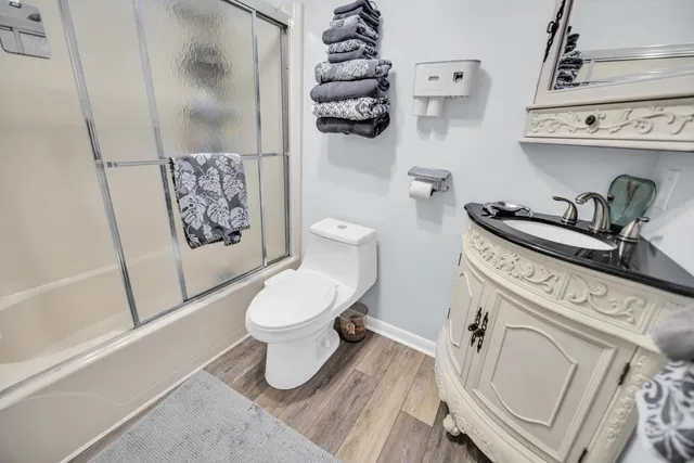 a bathroom with a toilet a sink and bathtub
