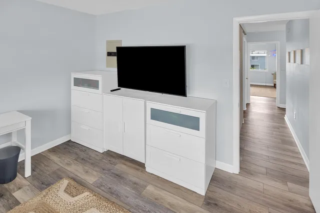 a view of a livingroom with wooden floor