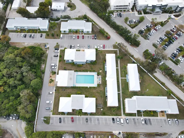 an aerial view of residential houses with outdoor space