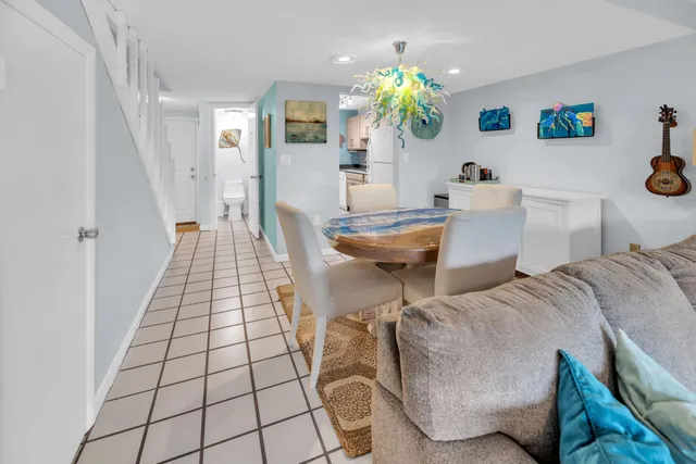 a living room with furniture and a rug
