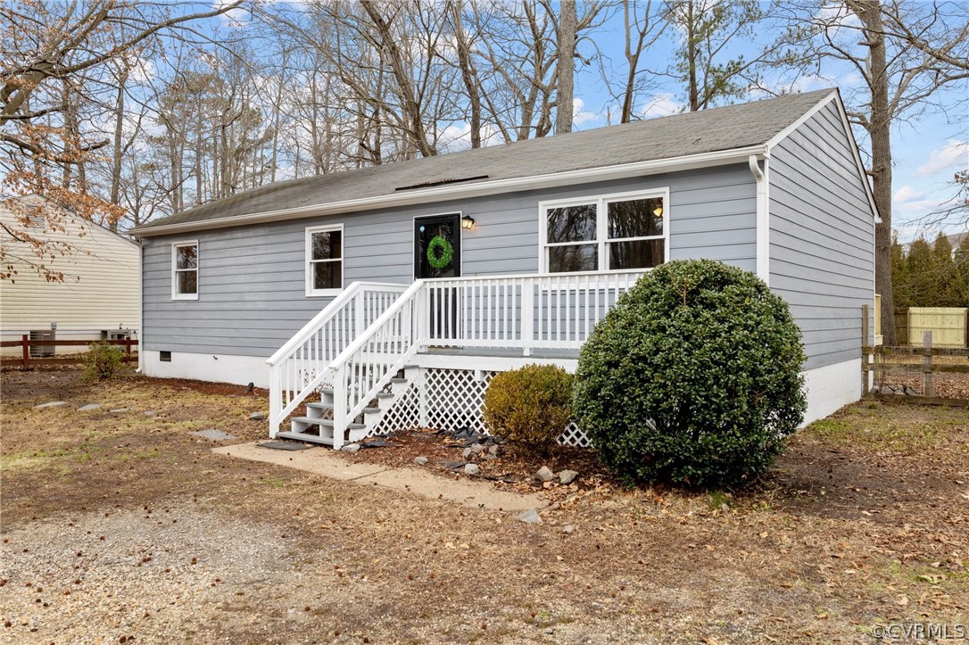 front view of a house with a bench