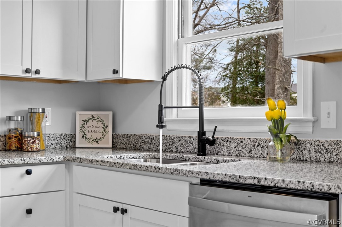 13913 Hackberry Road Chester, VA 23836 - Photo 12 of 27 a kitchen with granite countertop white cabinets and a sink