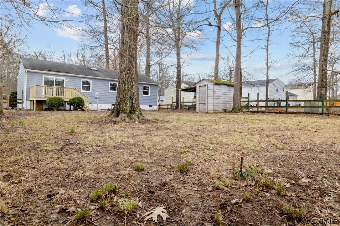13913 Hackberry Road Chester, VA 23836 - Photo 25 of 27 a view of a house with large trees and playing area