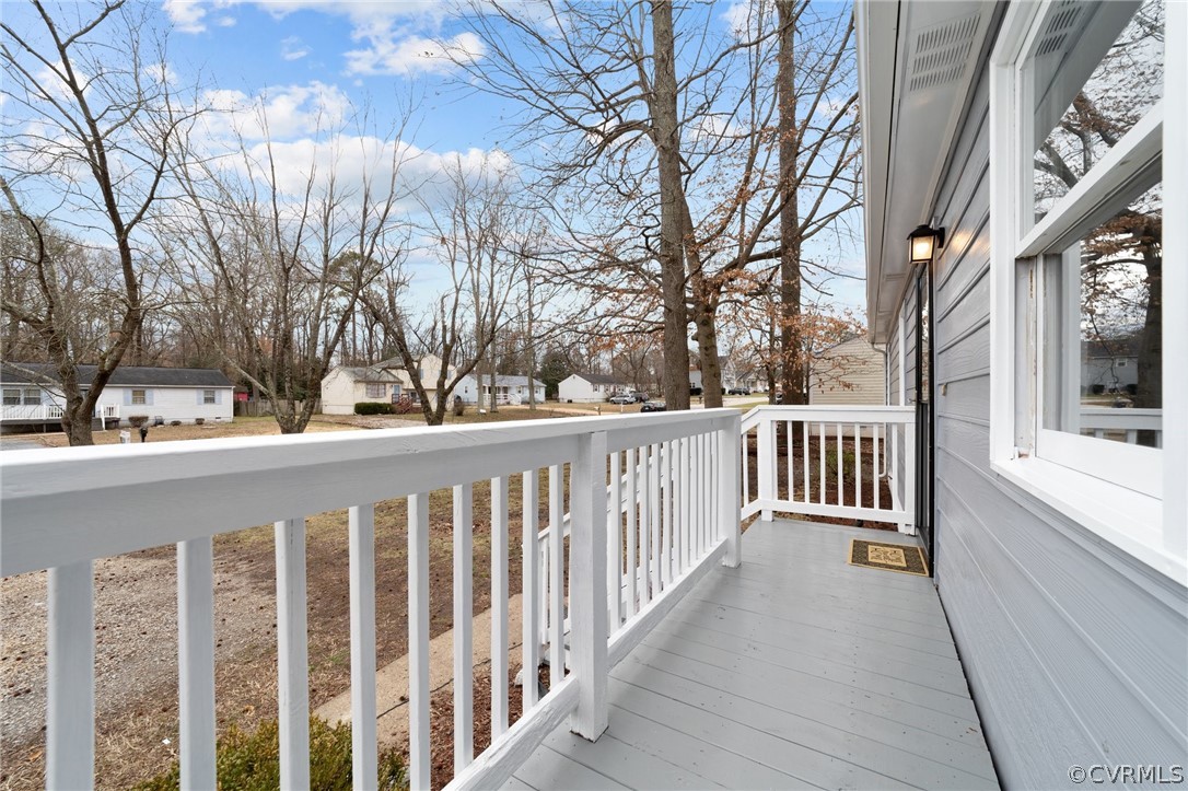 13913 Hackberry Road Chester, VA 23836 - Photo 3 of 27 a view of a white house with a small yard