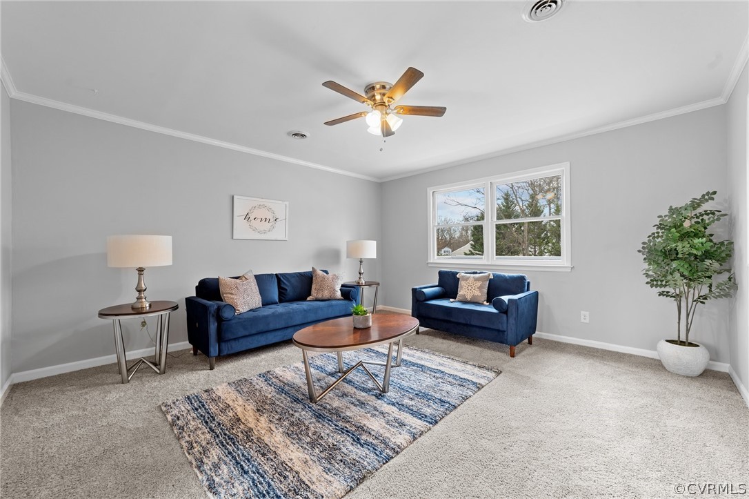 13913 Hackberry Road Chester, VA 23836 - Photo 5 of 27 a living room with furniture and a window